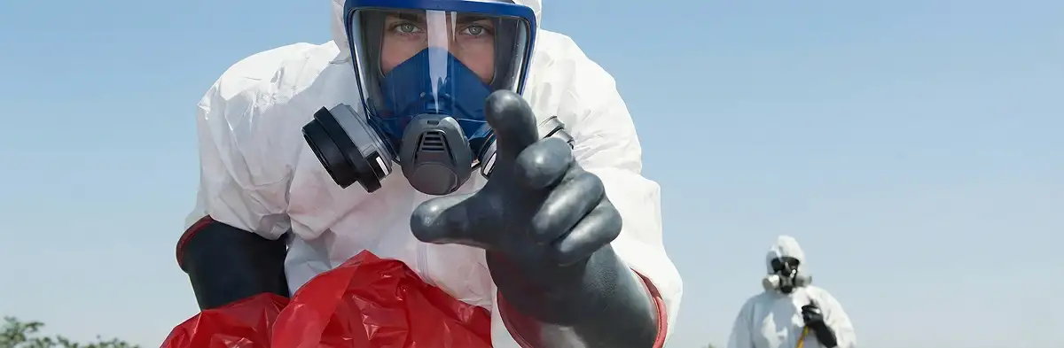 sewage clean up technician wearing protective gear handling biohazard materials in Philadelphia, PA