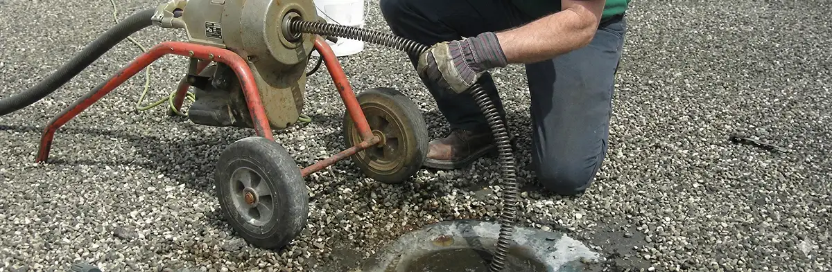 sewer rodding technician actively removing blockages from a sewer line in Philadelphia, PA