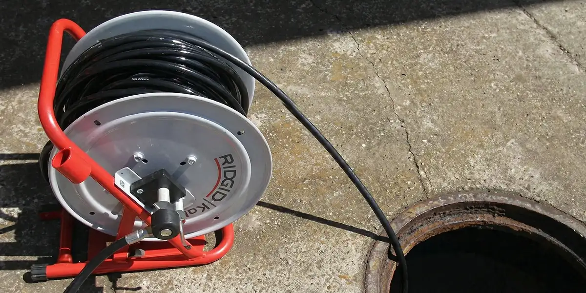 sewer rodding equipment prepared to clear clogged sewer lines in Philadelphia, PA
